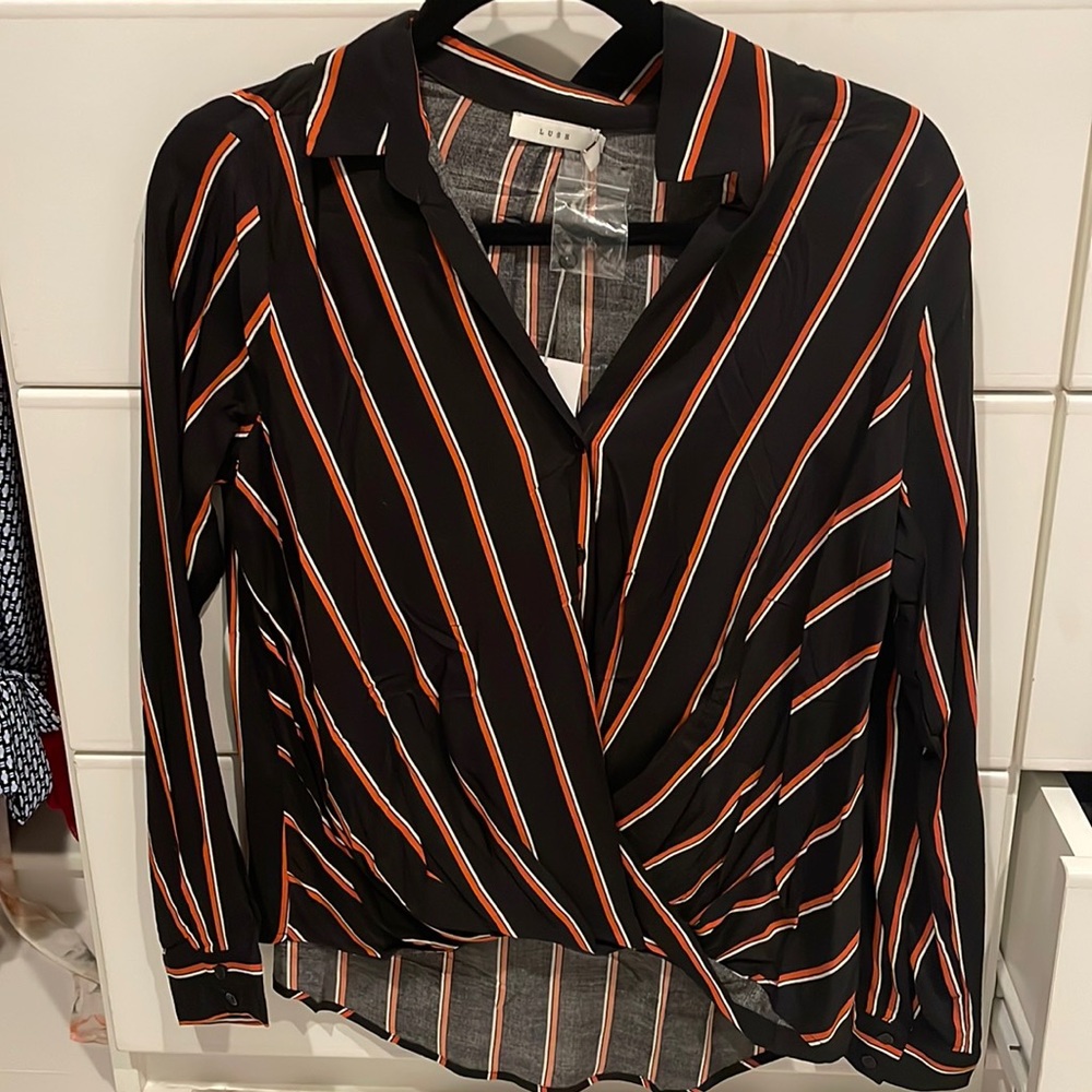 Brand new with tags size small, lush blouse. Button up and crossover front.